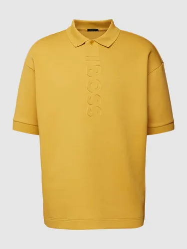 BOSS Green Relaxed Fit Poloshirt mit Marken-Detail Modell 'Pirax' in Dunkelgelb