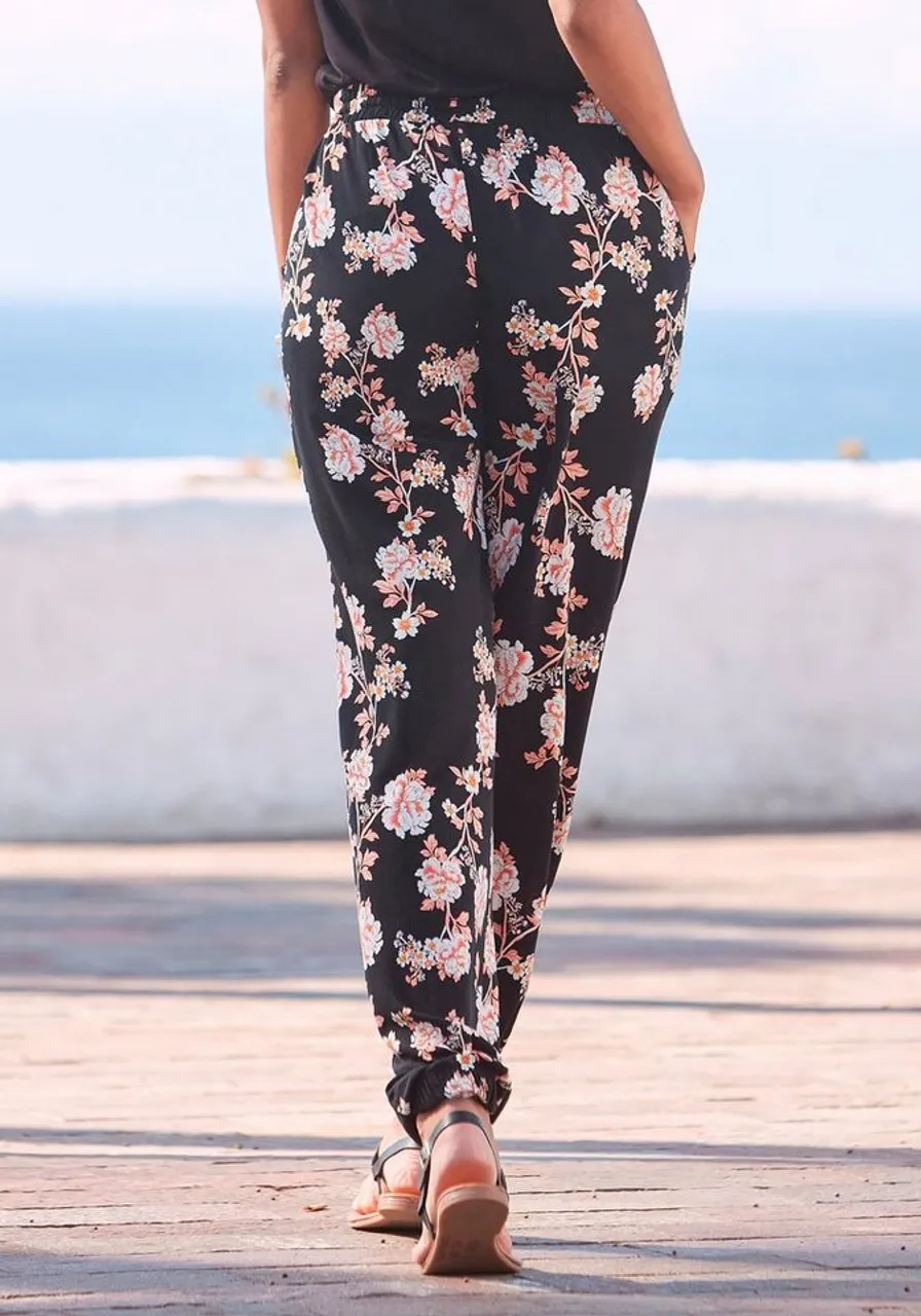 LASCANA Strandhose mit floralem Alloverdruck und Taschen, elastisch, lockere Passform