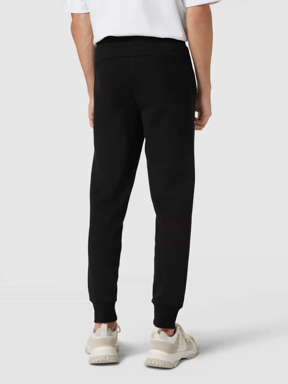 PUMA PERFORMANCE Sweatpants mit Label-Print in Black